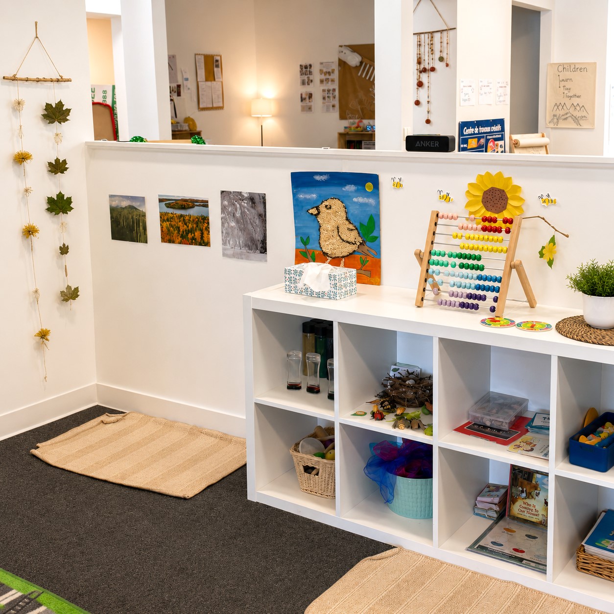 Warm, inviting toddler classroom at Edina Daycare with shared materials, open shelving, and collaborative play areas, supporting social interaction, communication, and relationship-building through group play experiences.